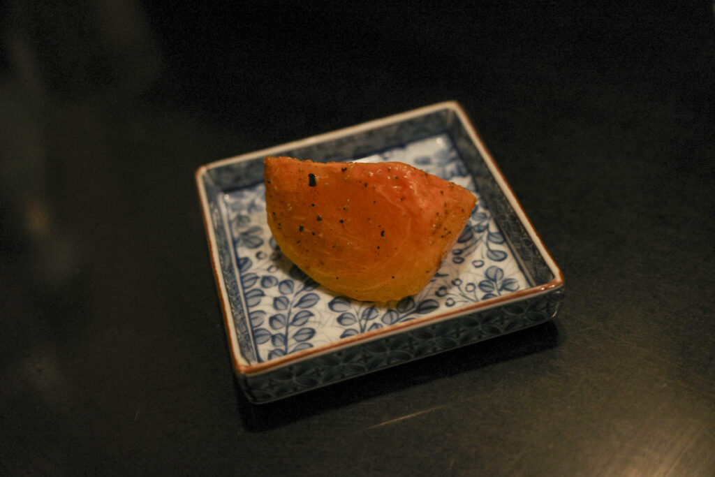 『牧谿(モッケイ)』お通し「柿の花椒和え」